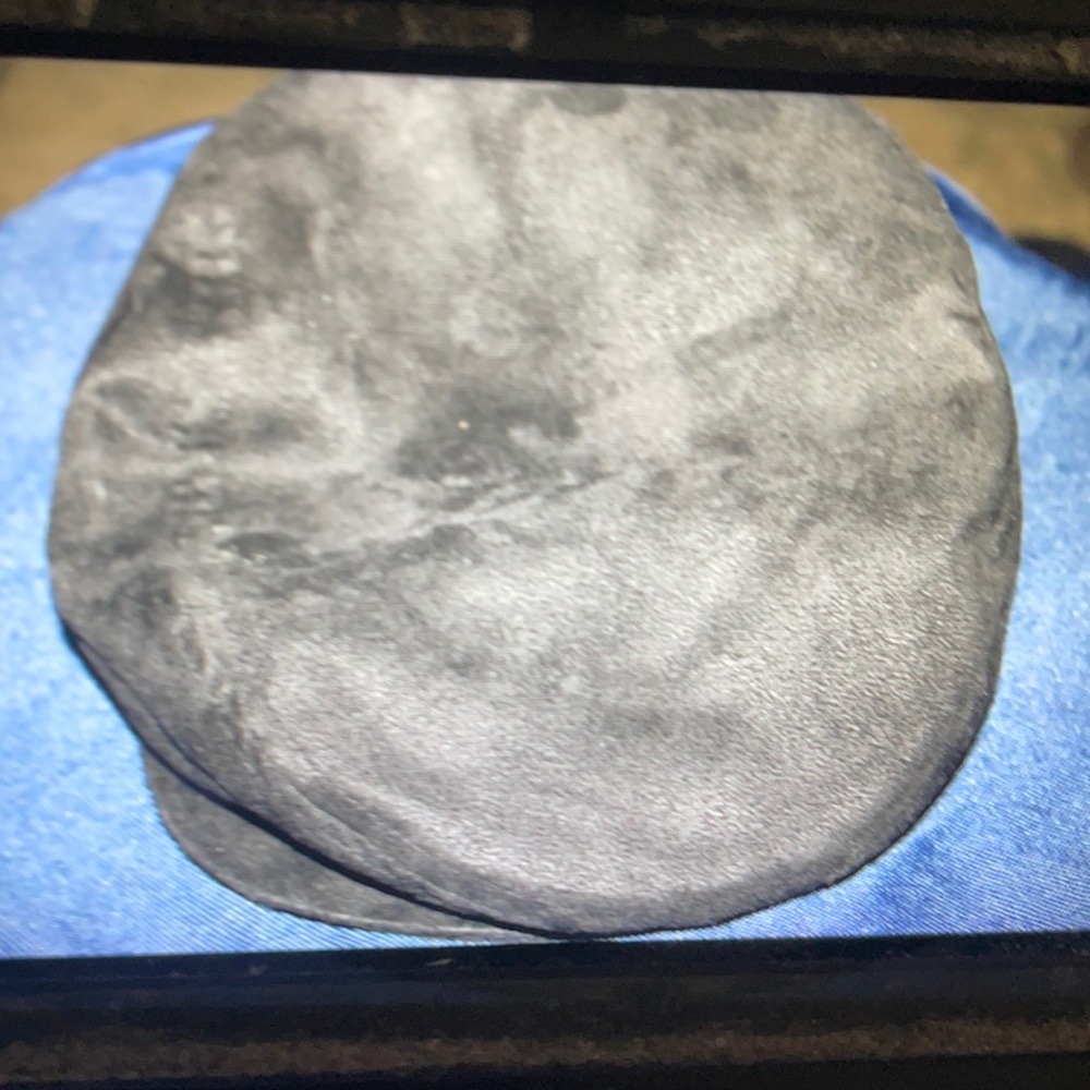 R O C this cap  is black and fax velour exterior and a fax fur interior.